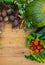 Harvest of fresh vegetables on wooden background. Top view. Potatoes, carrot, squash, peas, tomatoes