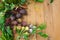 Harvest of fresh vegetables on wooden background. Top view. Potatoes, carrot, squash, peas, tomatoes