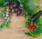 Harvest of fresh vegetables on wooden background. Top view. Potatoes, carrot, squash, peas, tomatoes