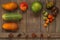 Harvest fruits and vegetables are composed in a composition on a wooden background