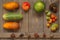 Harvest fruits and vegetables are composed in a composition on a wooden background