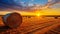 Harvest Harmony: A Field of Straw Bales and the Setting Sun Create a Spectacular Visual Symphony