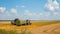 Harvest machine loading seeds in to trailer