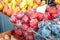 Harvest of red and blue ripe plums is on the counter of the farmers ` market. the crop is for sale