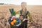 Harvest time in the country, woman farmer offering vegetables