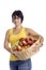 Harvest:young woman with basket full of apples