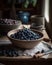 The harvested blueberries are placed in a bowl in the kitchen.