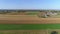 Harvested Corn Fields and Rolled Corn Stalks and Amish Farm Steads on a Sunny Autumn Day