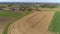 Harvested Corn Fields and Rolled Corn Stalks and Amish Farm Steads on a Sunny Autumn Day