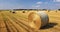 Harvested field with straw bales with Agriculture background. Summer and autumn harvest concept