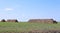 Harvested hay rolls lying on the field