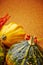 Harvested pumpkins with fall leaves, autumn background