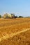 Harvester agriculture machine harvesting golden ripe corn field. Tractor - hay and straw, traditional summer background with an i