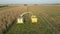 Harvester Collect Ripe Corn At Agricultural Field And Pour It In Truck Trailer