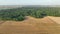 Harvester combine drone aerial view during harvesting harvest tractor of cereals wheat cuts crop Triticum aestivum field