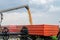 Harvester combine pouring wheat seeds in tractor trailer harvest