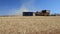 Harvester combine thrash wheat field