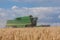 Harvester in corn field