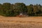 Harvester on a Danish field near Vordingborg