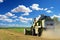 Harvester harvesting barley in summer