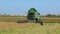 Harvester machine to harvest rice field working in Albufera