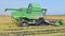 Harvester machine to harvest rice field working in Albufera