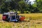 Harvester machine to harvest wheat field working. Combine harvester agriculture machine harvesting golden ripe wheat field in Thai