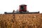 Harvester making harvesting soybean field .