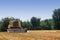 Harvester thresher on wheat field