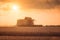 Harvester in wheat field