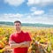 Harvester winemaker farmer proud of his vineyard