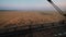 Harvesters for harvesting grain while working. View from the combine harvester cab, harvesting machinery in the field