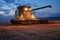 Harvesting by combine in the field in the dark and evening. Against the background of the sunset sky. Night work