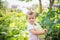 Harvesting in garden. child holds vegetable squash. first baby food. low allergenic product.