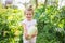 Harvesting in garden. happy child holds vegetable squash. first baby food. low allergenic product