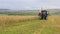 Harvesting grain a tractor