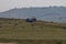 Harvesting hay tractor work on field make haystacks, Plana mountain