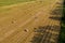 Harvesting hay for the winter, fodder for cattle, round bales in the field view from above