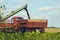 Harvesting rapeseed on a sunny summer day