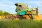 Harvesting in Ukraine combine harvester mows wheat in the field