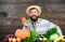 Harvesting vegetables. man chef with rich autumn crop. seasonal vitamin food. Useful fruit and vegetable. bearded mature