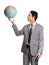 He has the business world at his fingertips. A handsome young executive holding a globe while isolated on a white