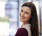 She has an entrepreneurial drive. Portrait of a smiling young businesswoman standing in an office.