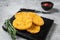 Hash brown potato with ketchup, hashbrown on white table. Gray background. Top view