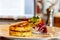 Hashbrown potato patties are served with salad