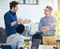 Hashing out new ideas. Shot of a group of coworkers talking together in an office.