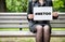 Hashtag for Mee Too movement Woman sitting on a bench at the park