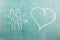 Hashtag sign and heart drawn on school chalkboard