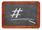 Hashtag and white chalk on blackboard