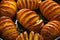 Hasselback baked potatoes served in cast-iron pan with salt, pepper and herbs